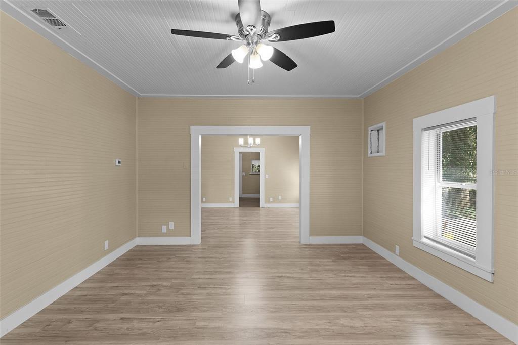 2245 Northwest 63rd Place Ocala, FL 34475 - Photo 27 of 38 a view of empty room with wooden floor and fan