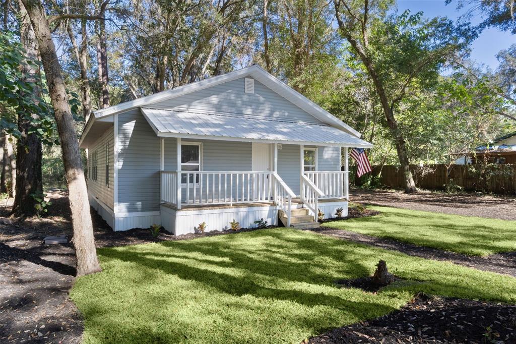 2245 Northwest 63rd Place Ocala, FL 34475 - Photo 3 of 38 a view of a house with a yard patio and a tree