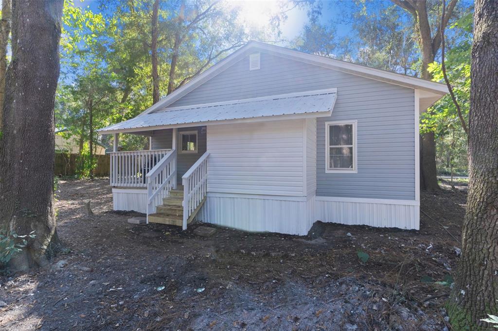 2245 Northwest 63rd Place Ocala, FL 34475 - Photo 33 of 38 a view of a house with a yard