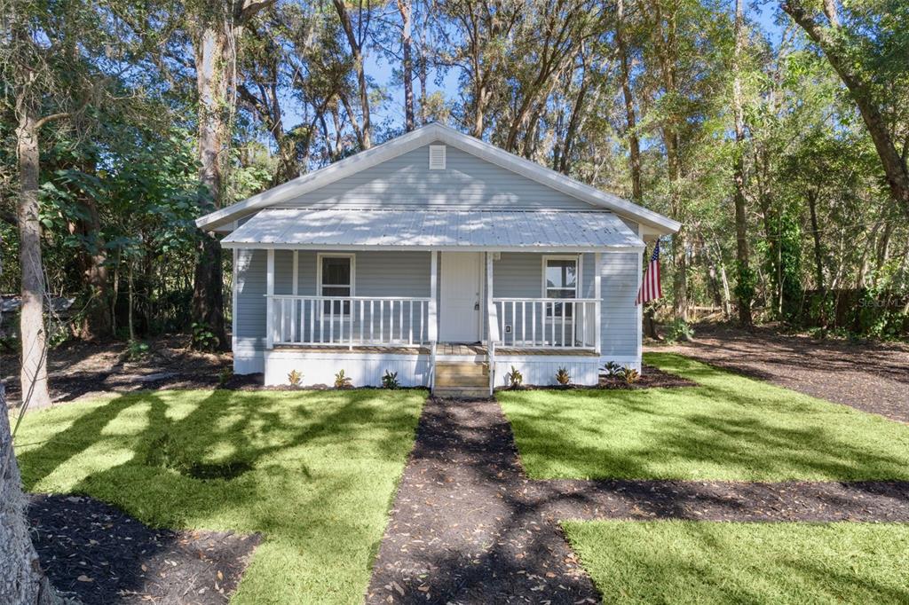 2245 Northwest 63rd Place Ocala, FL 34475 - Photo 5 of 38 a backyard of a house with table and chairs