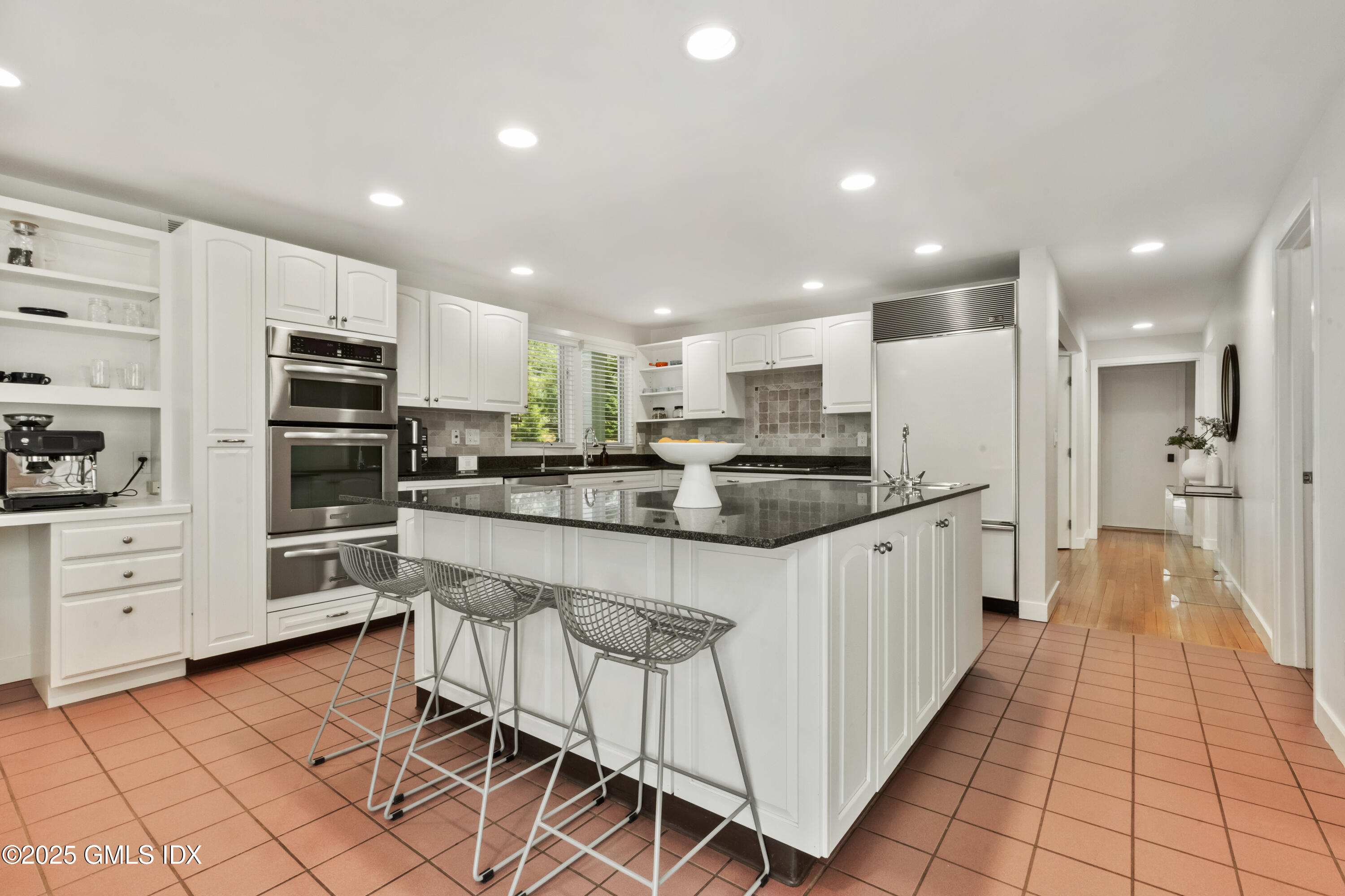 254 Stanwich Road Greenwich, CT 06830 - Photo 11 of 52 a kitchen with stainless steel appliances kitchen island granite countertop a refrigerator and a stove top oven