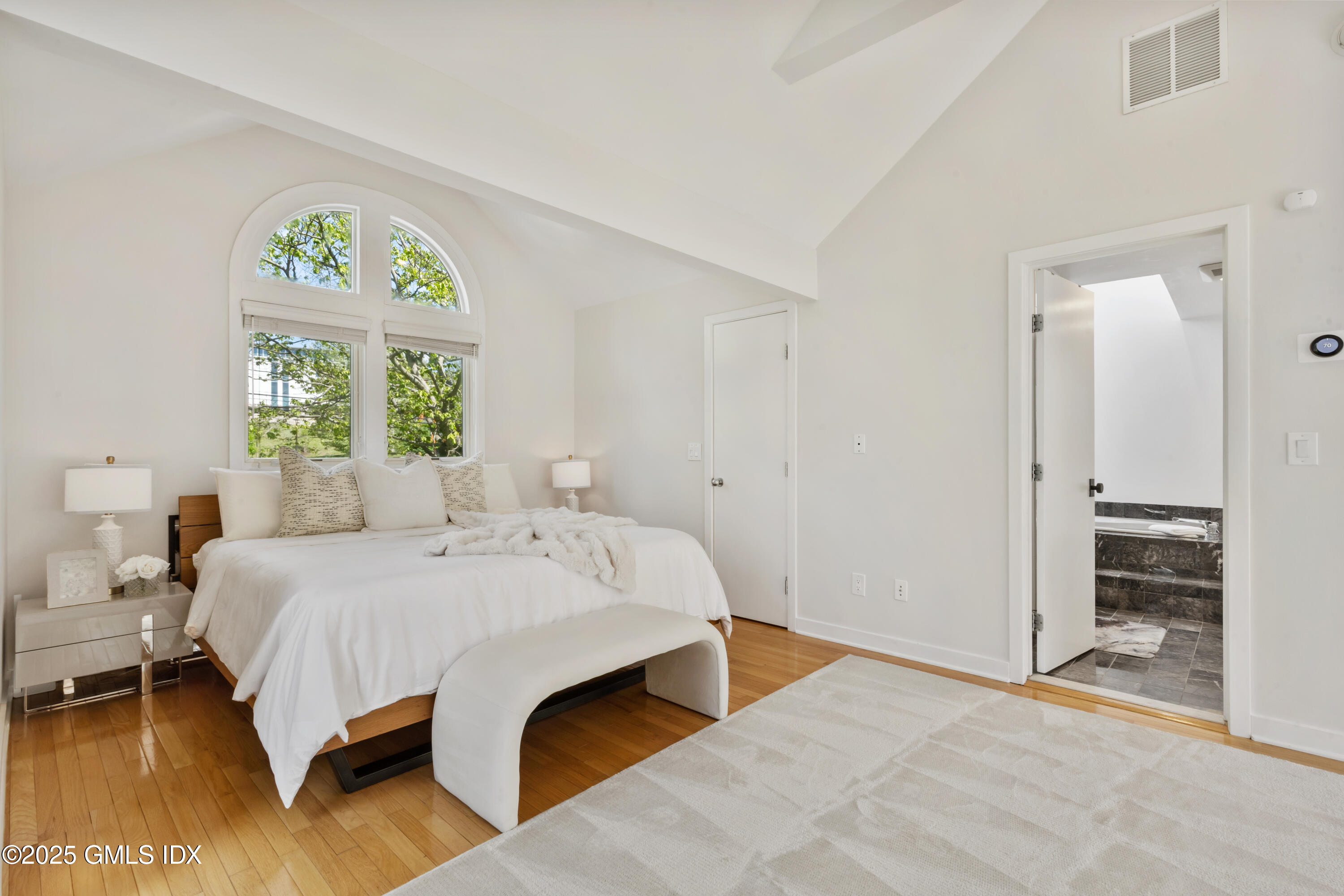 254 Stanwich Road Greenwich, CT 06830 - Photo 19 of 52 a bedroom with a bed and a window