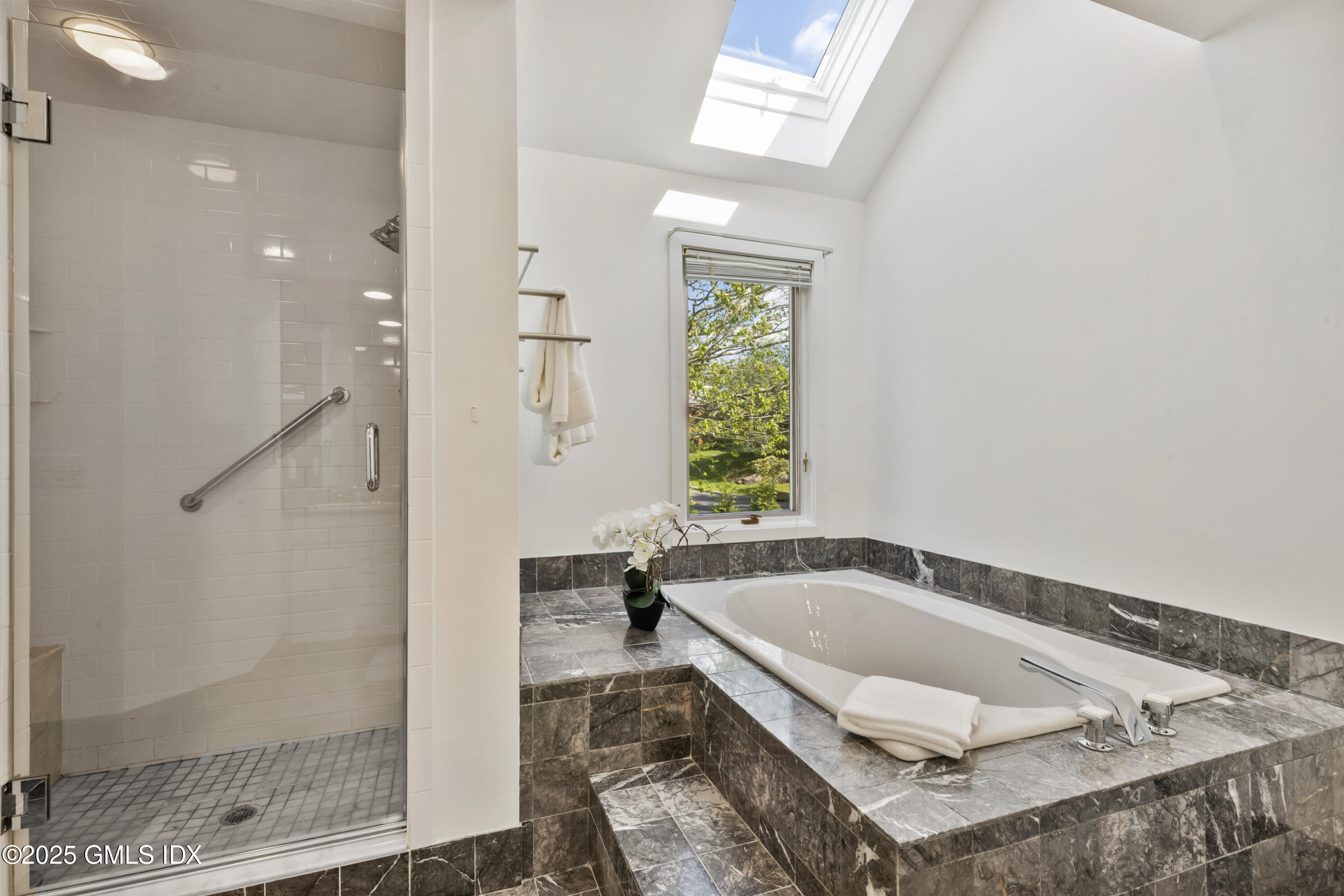254 Stanwich Road Greenwich, CT 06830 - Photo 22 of 52 a white bath tub sitting in a bathroom next to a window
