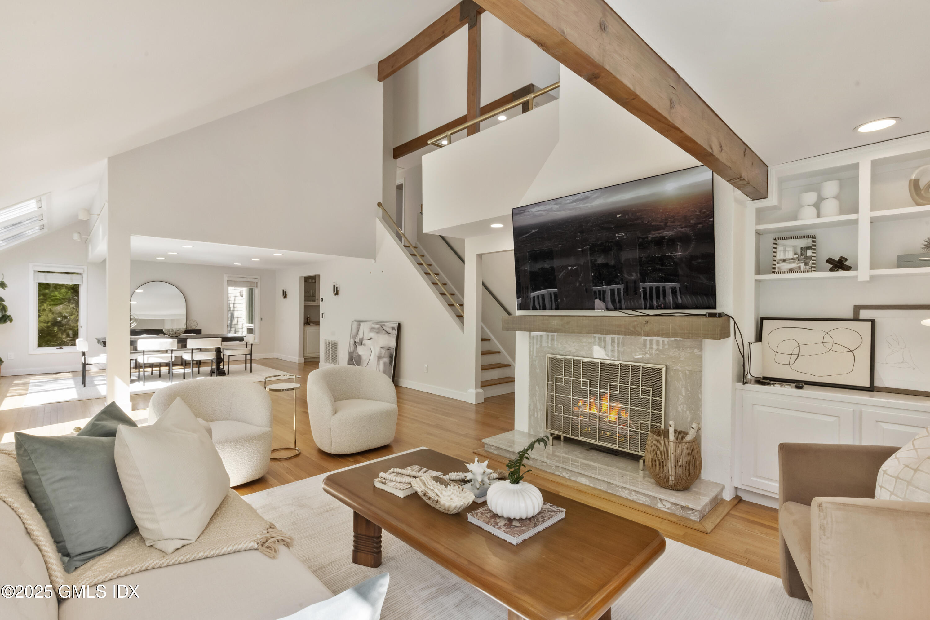 254 Stanwich Road Greenwich, CT 06830 - Photo 3 of 52 a living room with furniture a fireplace and a flat screen tv