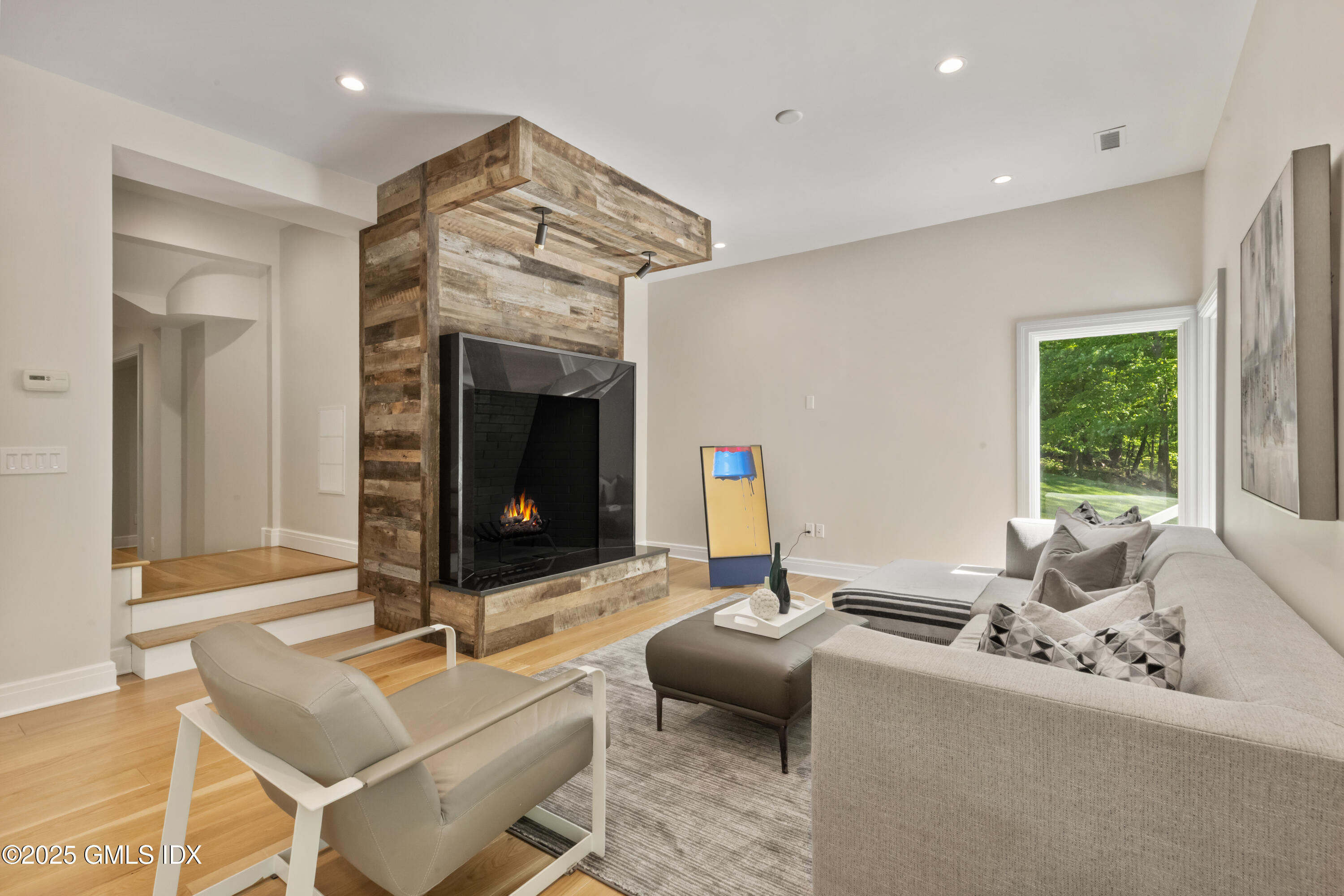 254 Stanwich Road Greenwich, CT 06830 - Photo 33 of 52 a living room with furniture and a fireplace