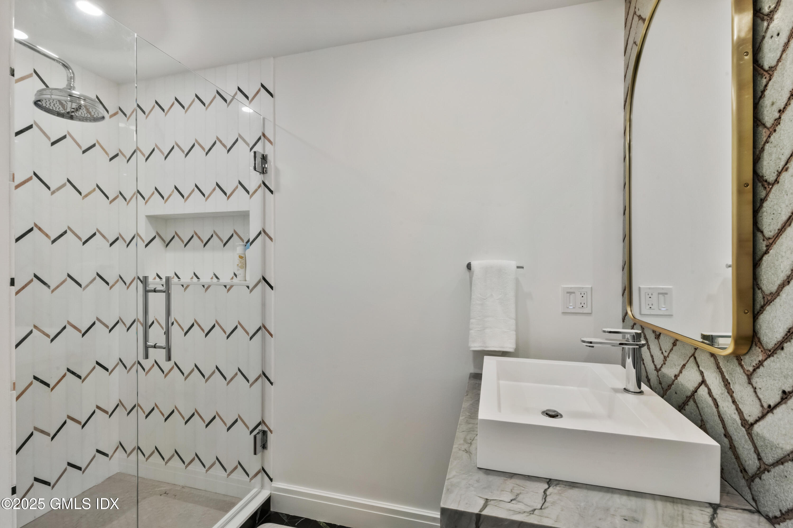 254 Stanwich Road Greenwich, CT 06830 - Photo 34 of 52 a bathroom with a bathtub and a shower