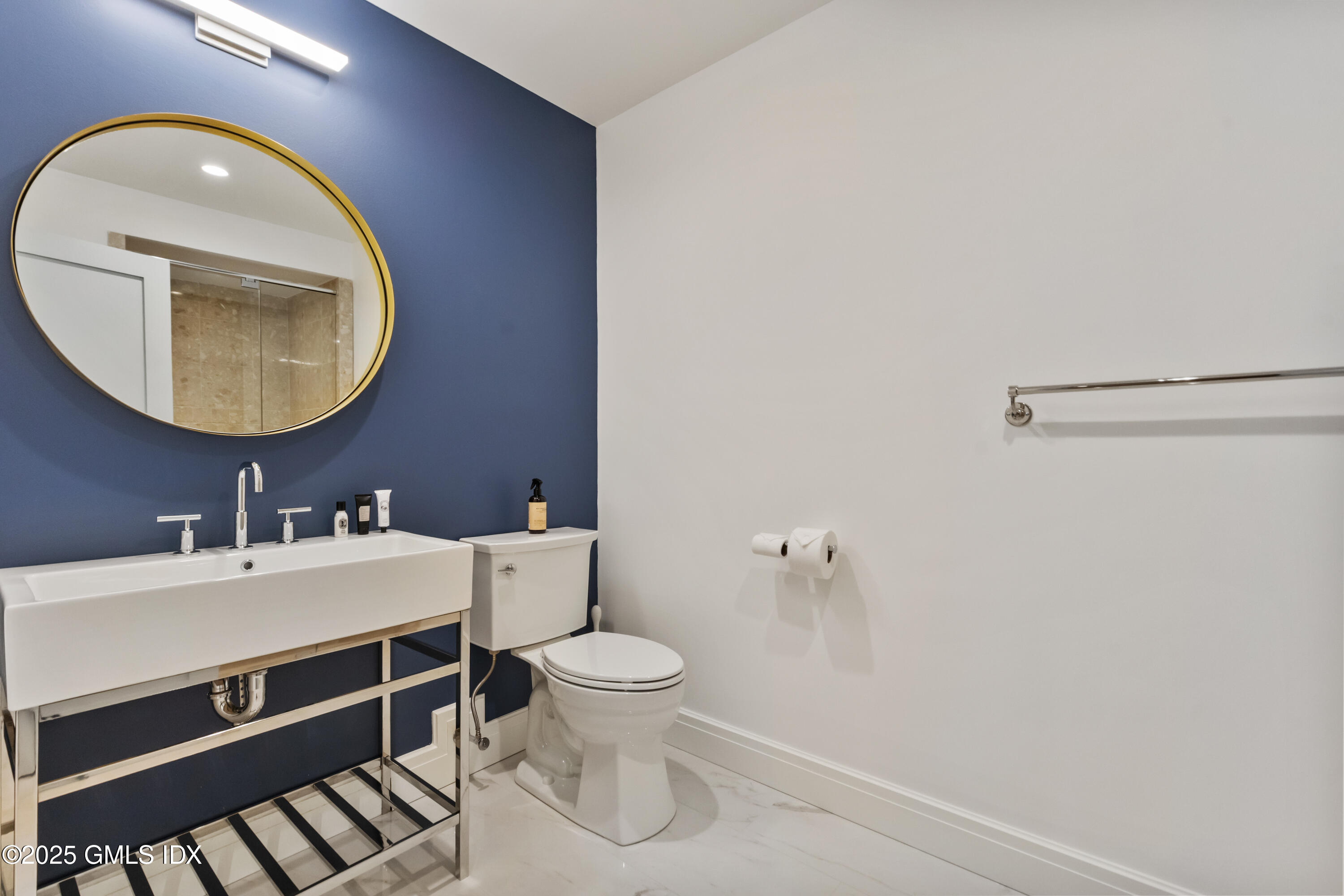 254 Stanwich Road Greenwich, CT 06830 - Photo 39 of 52 a bathroom with a sink mirror vanity and toilet
