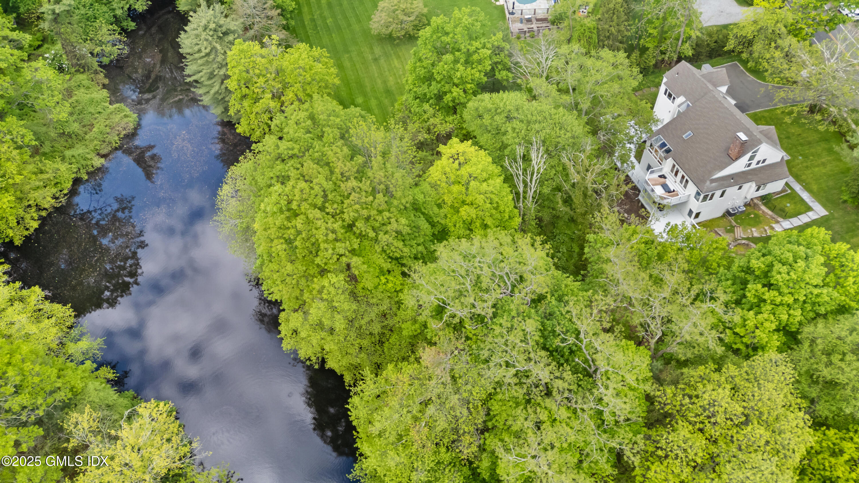 254 Stanwich Road Greenwich, CT 06830 - Photo 43 of 52 an aerial view of a house with a yard and garden