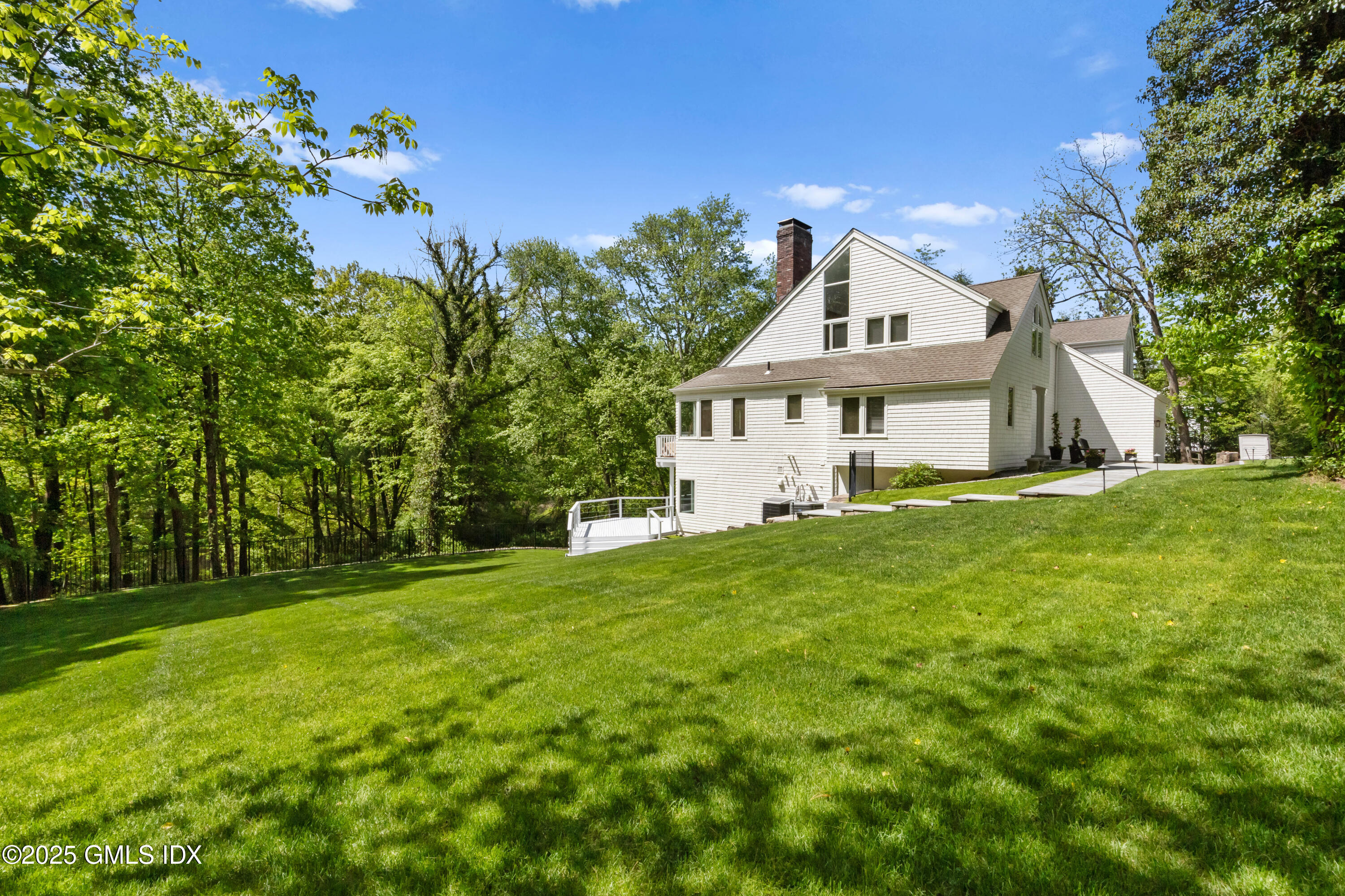 254 Stanwich Road Greenwich, CT 06830 - Photo 45 of 52 a house view with a garden space
