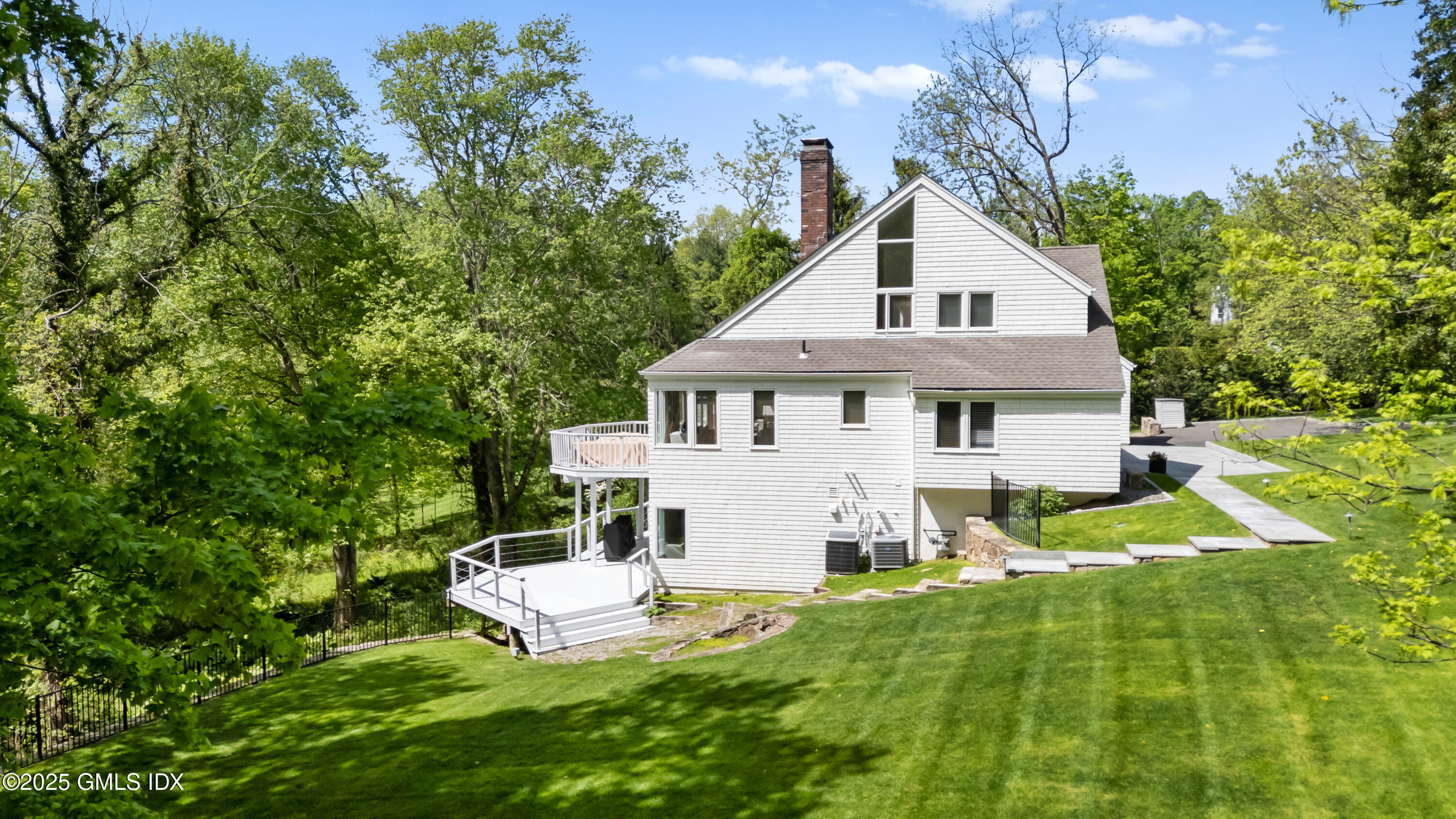 254 Stanwich Road Greenwich, CT 06830 - Photo 46 of 52 a aerial view of a house with a yard table and chairs