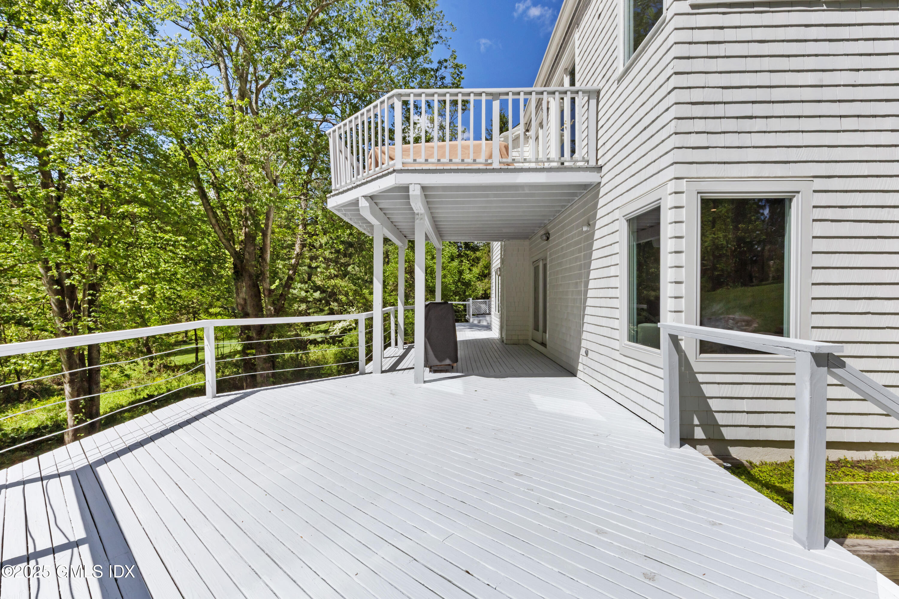 254 Stanwich Road Greenwich, CT 06830 - Photo 47 of 52 a view of a house with wooden deck