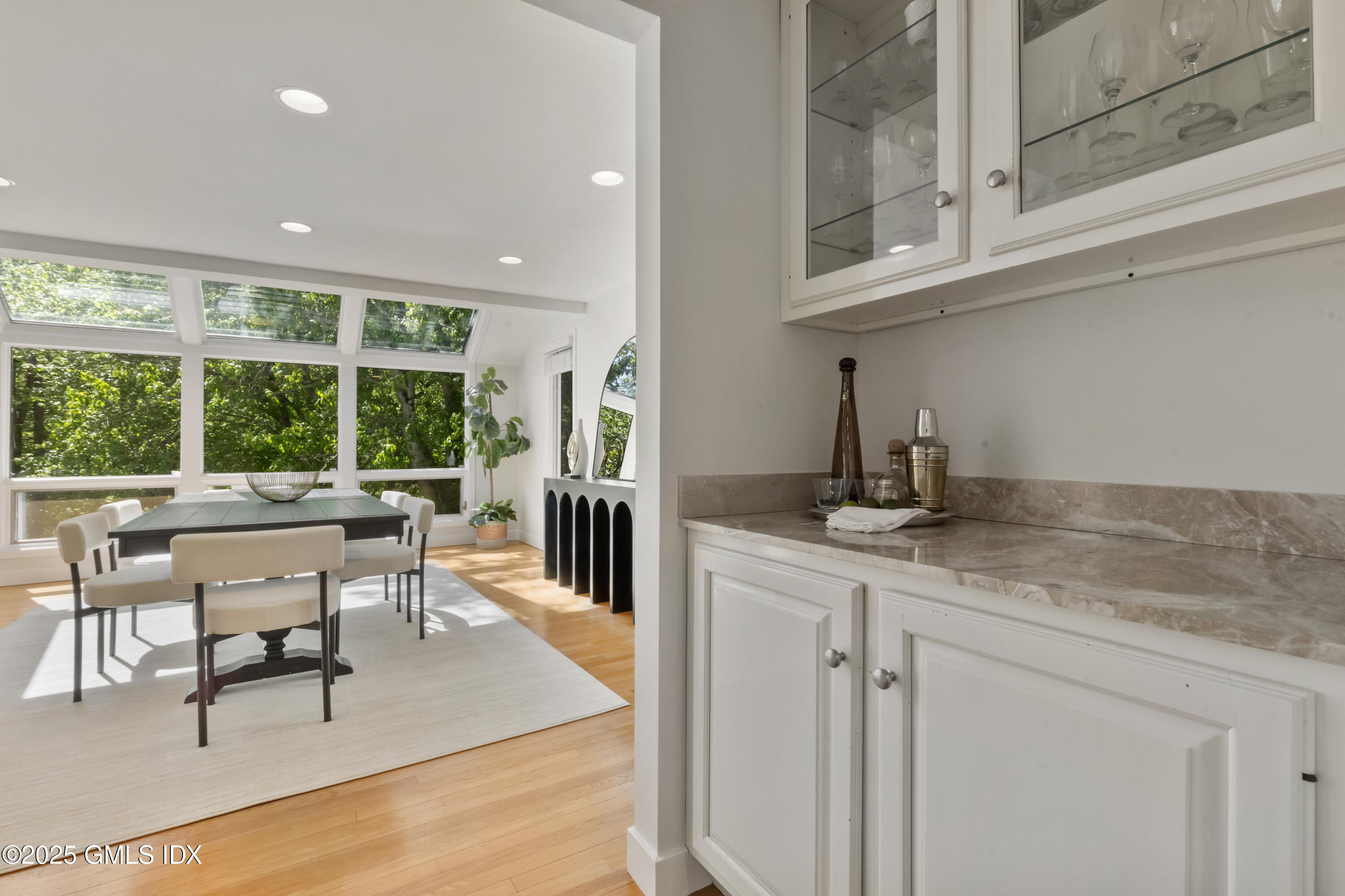 254 Stanwich Road Greenwich, CT 06830 - Photo 10 of 52 a view of a kitchen with dining table and chairs