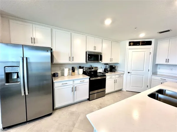 a view of a dining room with furniture and a window