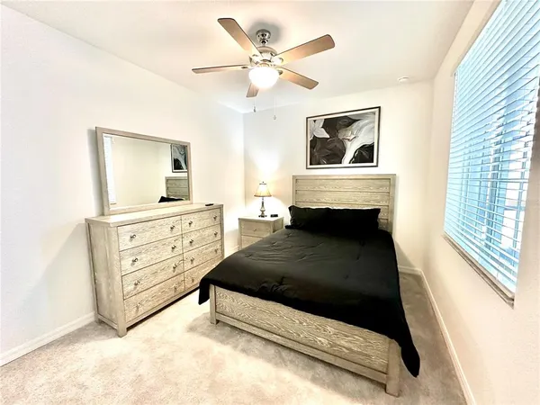 a very nice looking room with a glass door and a bathroom