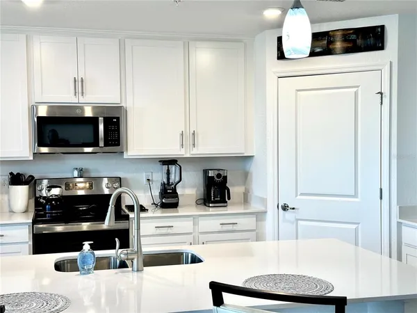 a view of yard with swimming pool and green space