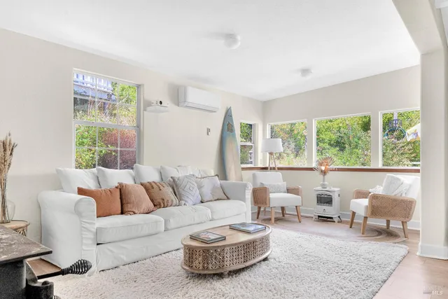 a bedroom with a large bed and a large window