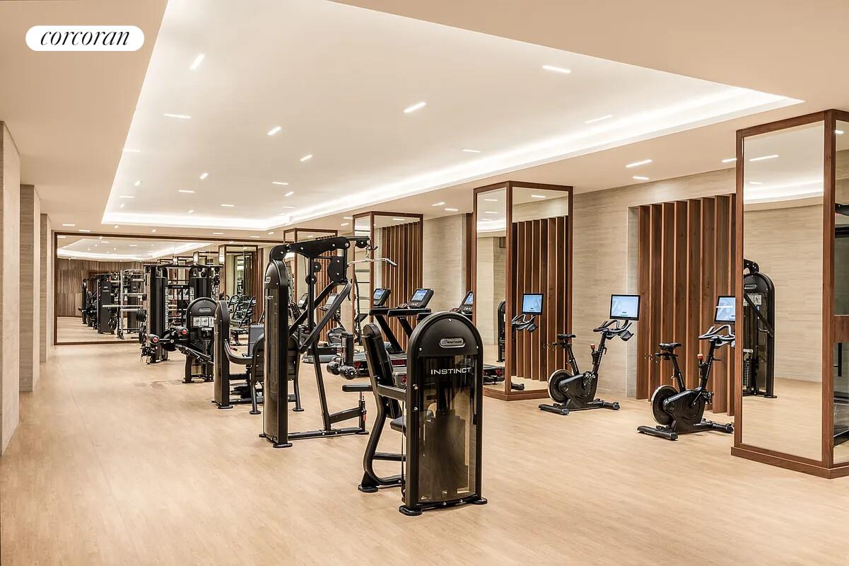 108 Leonard Street, Unit 4N Manhattan, NY 10013 - Photo 24 of 31 a view of a room with gym equipment