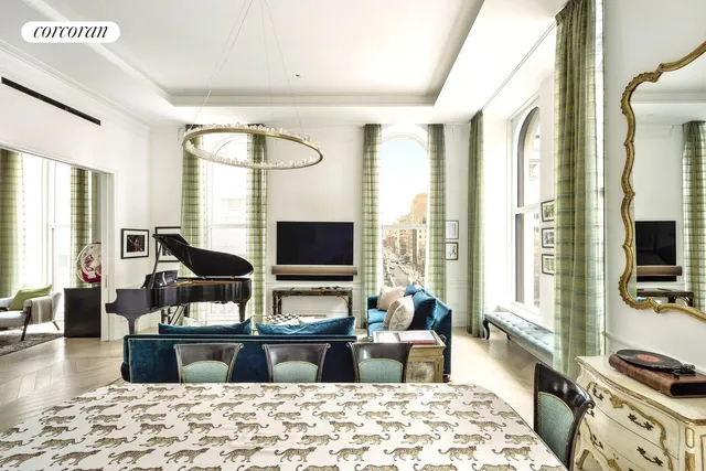 a kitchen with granite countertop a table chairs sink and cabinets