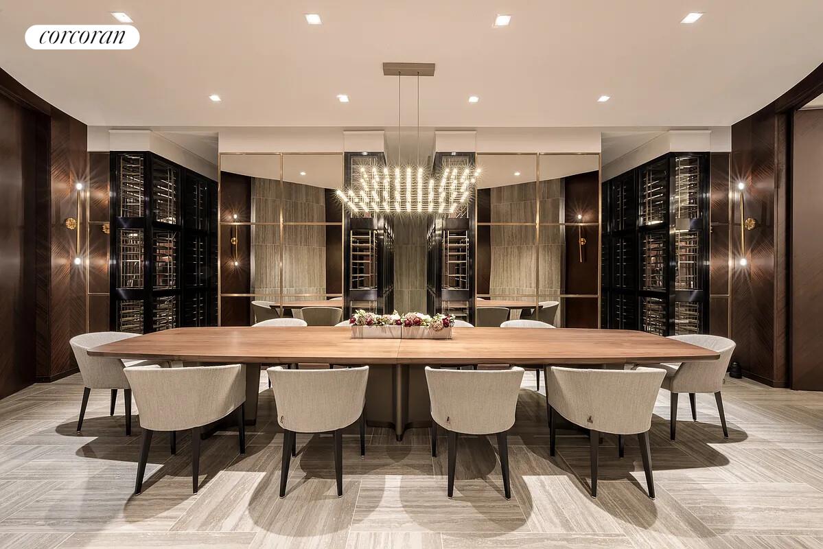 108 Leonard Street, Unit 4N Manhattan, NY 10013 - Photo 10 of 18 a room with stainless steel appliances a dining table and chairs