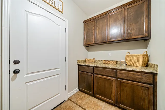 a view of cabinets with washer dryer