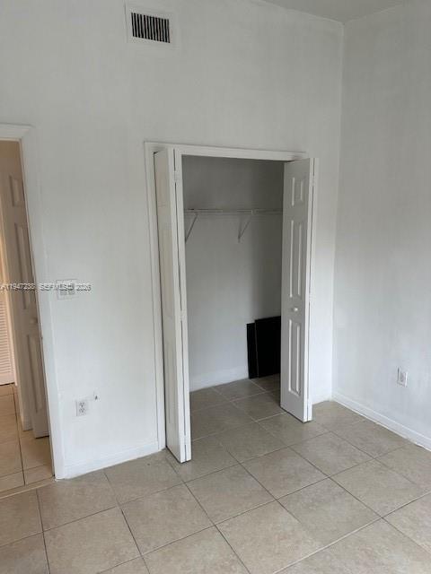 2920 Southeast 13th Road, Unit 20345 Homestead, FL 33035 - Photo 14 of 17 an empty room with a bench and closet