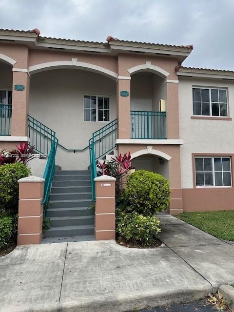 2920 Southeast 13th Road, Unit 20345 Homestead, FL 33035 - Photo 5 of 17 a front view of a house with a garden