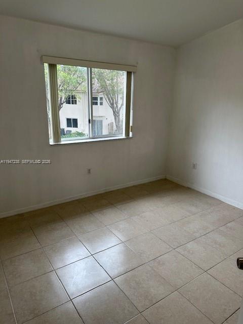 2920 Southeast 13th Road, Unit 20345 Homestead, FL 33035 - Photo 9 of 17 a view of an empty room with a window