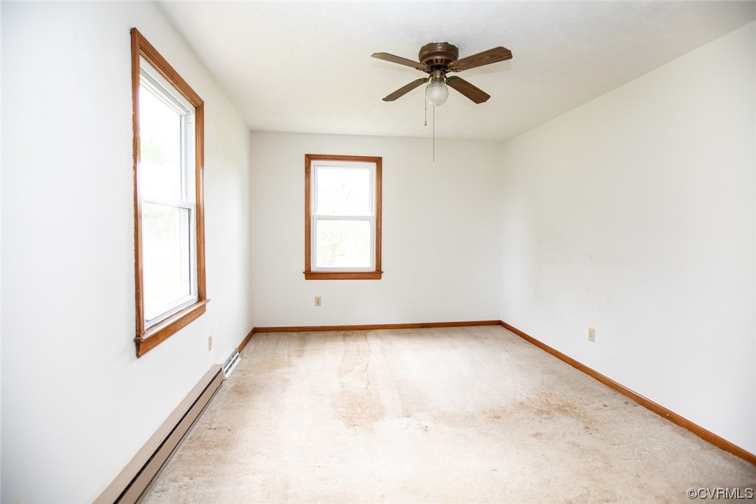 71 Spillman Road Farmville, VA 23901 - Photo 18 of 48 an empty room with a window and a ceiling fan