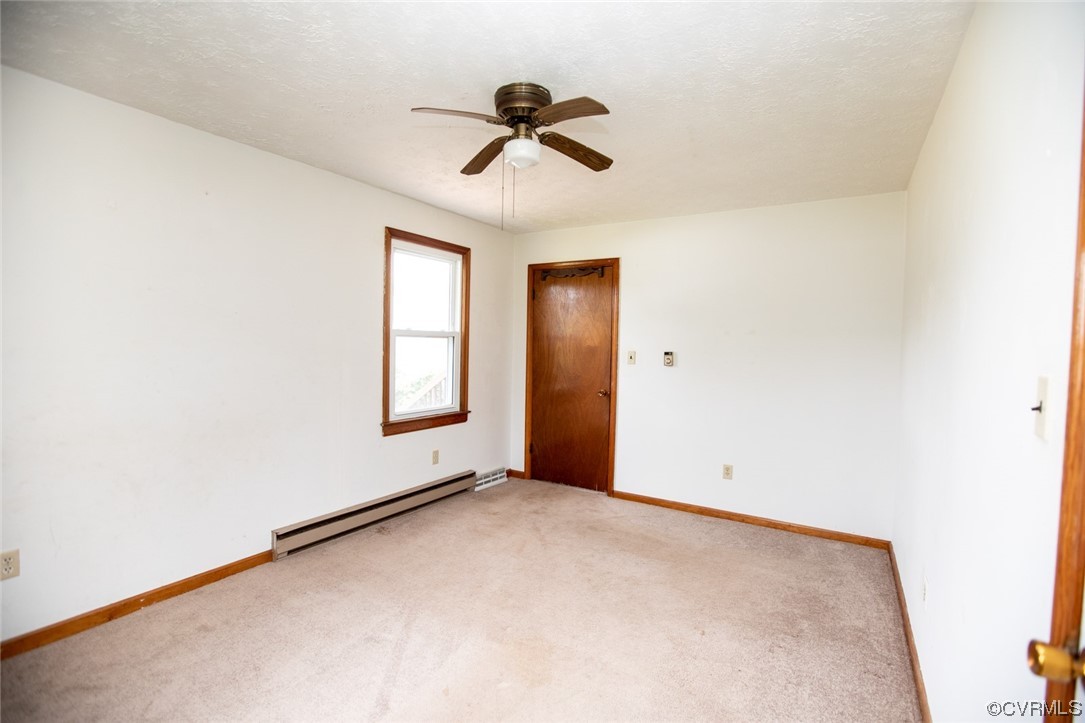71 Spillman Road Farmville, VA 23901 - Photo 22 of 48 an empty room with windows and fan