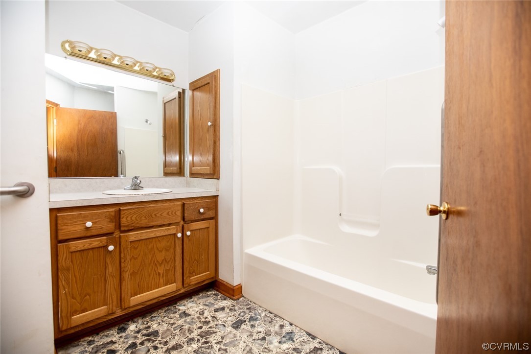 71 Spillman Road Farmville, VA 23901 - Photo 26 of 48 a bathroom with a tub sink and mirror