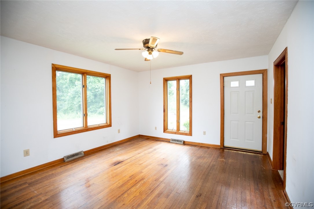 71 Spillman Road Farmville, VA 23901 - Photo 3 of 48 a view of an empty room with wooden floor and a window