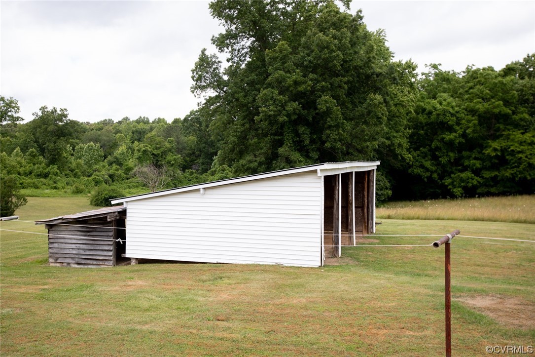71 Spillman Road Farmville, VA 23901 - Photo 42 of 48 a backyard of a house with large trees