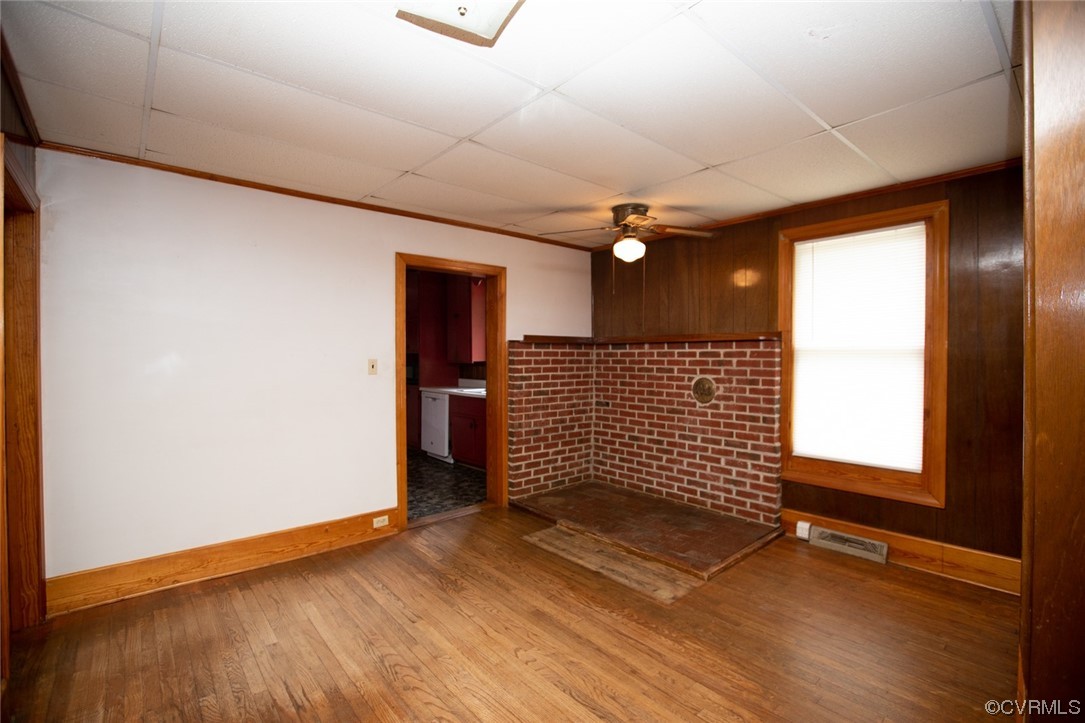 71 Spillman Road Farmville, VA 23901 - Photo 6 of 48 a view of an empty room with wooden floor and a window