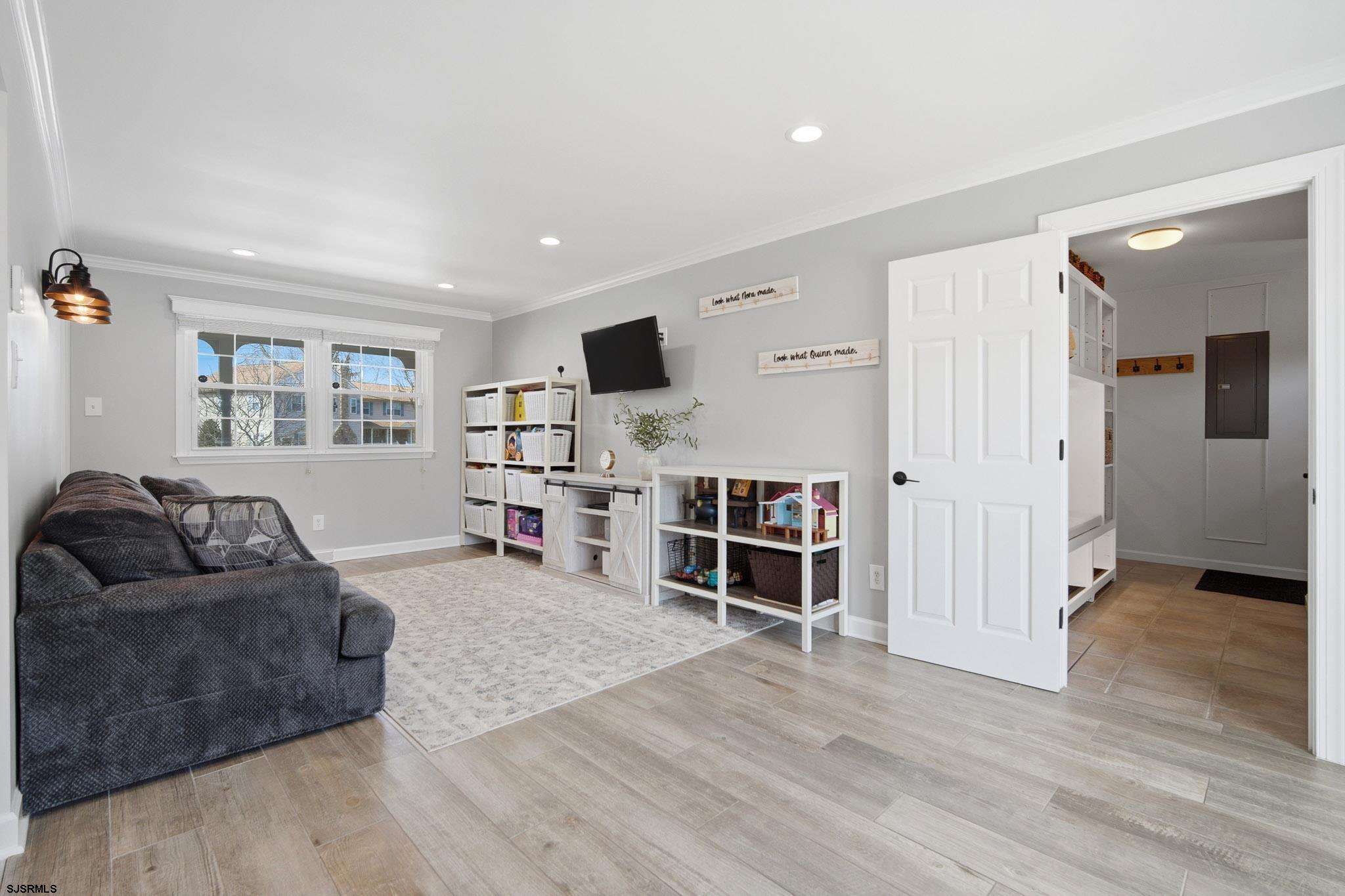 2104 Grove Road Northfield, NJ 08225 - Photo 12 of 33 a living room with furniture and a flat screen tv