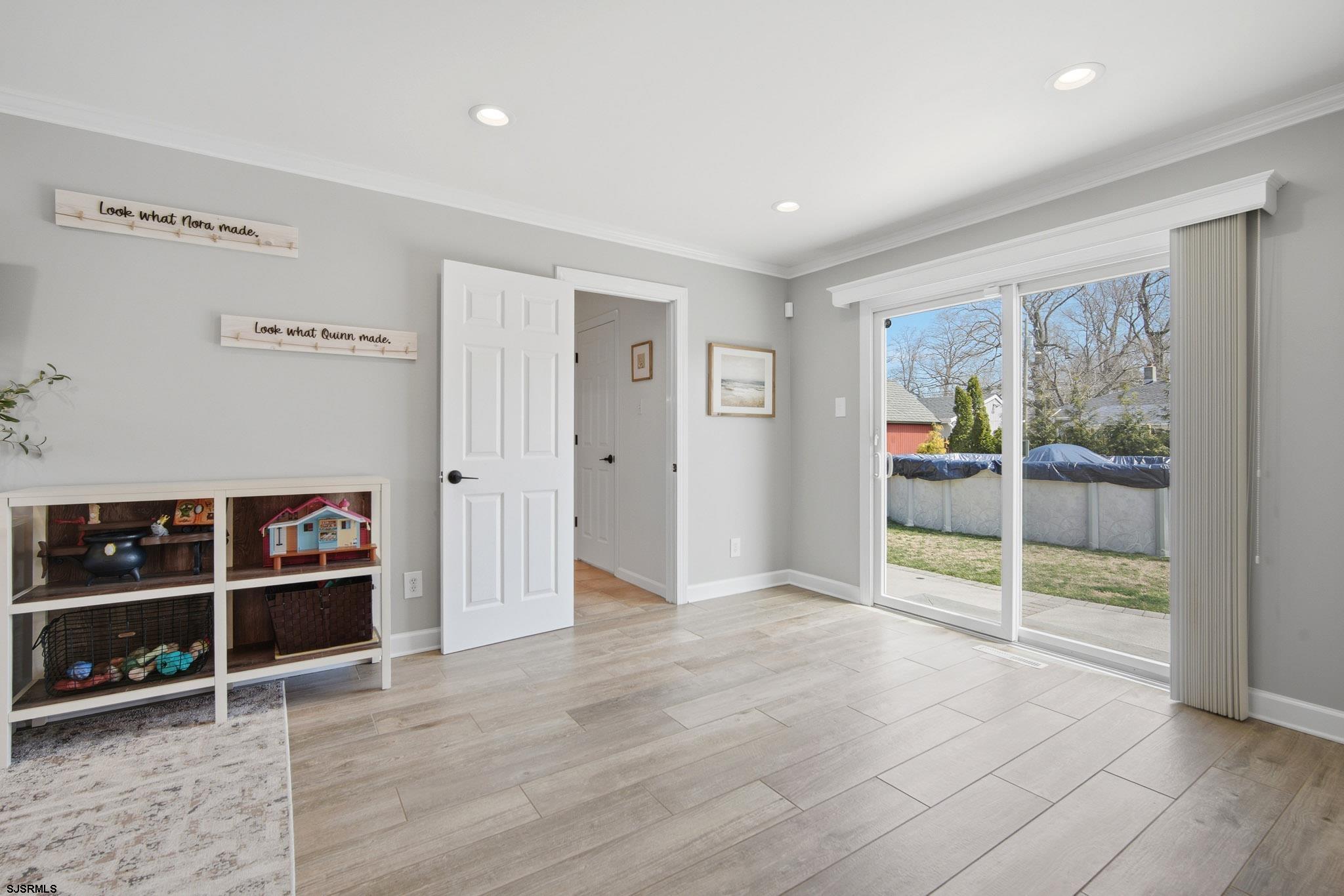 2104 Grove Road Northfield, NJ 08225 - Photo 14 of 33 a view of an empty room with wooden floor and a window