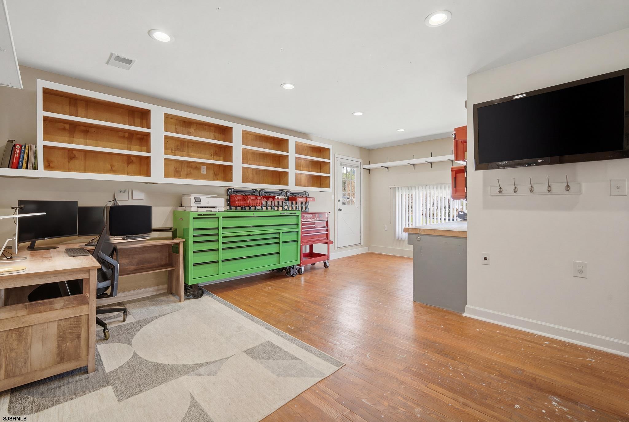 2104 Grove Road Northfield, NJ 08225 - Photo 17 of 33 a living room with furniture and a flat screen tv