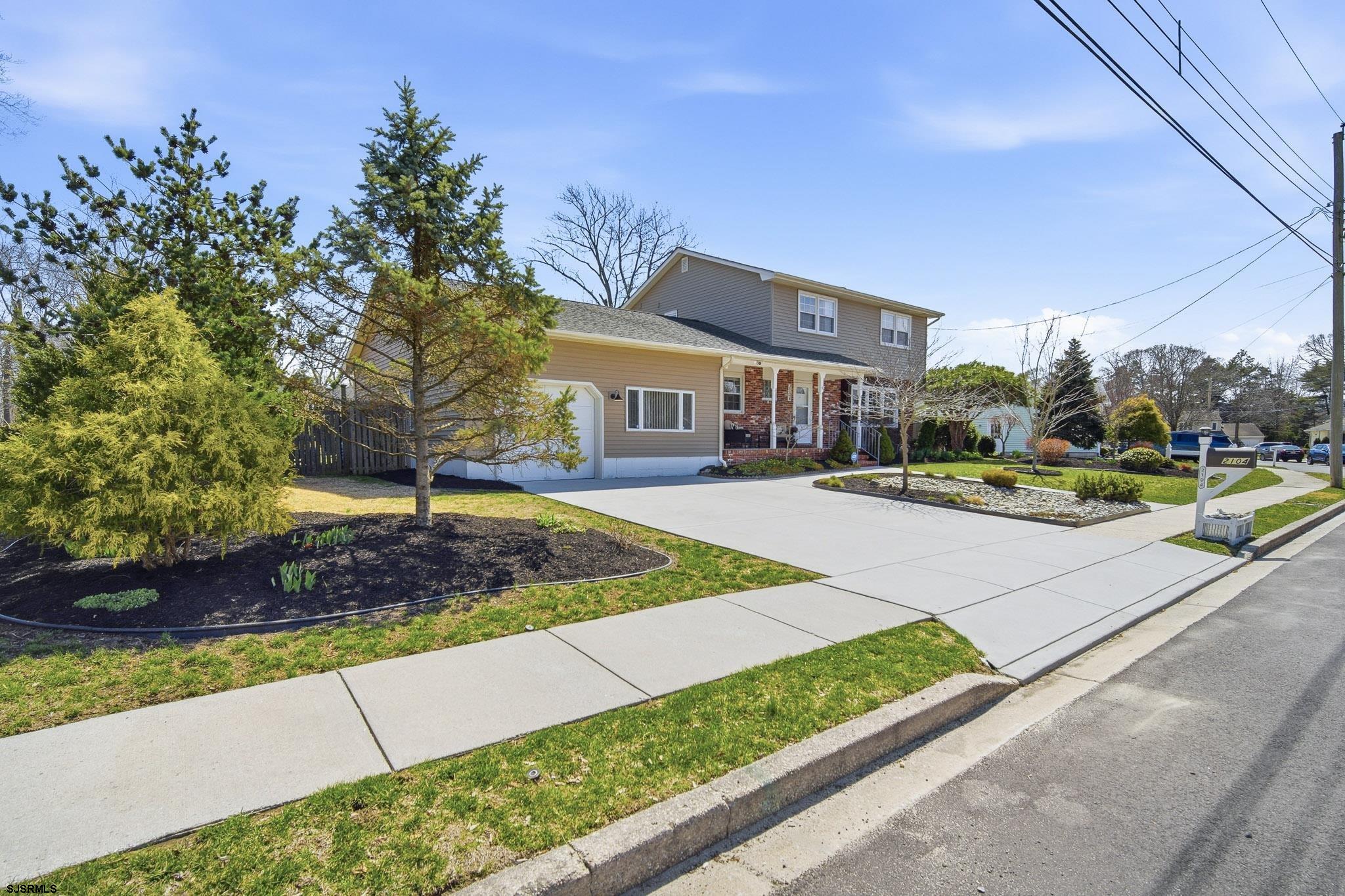 2104 Grove Road Northfield, NJ 08225 - Photo 2 of 33 a front view of a house with a yard