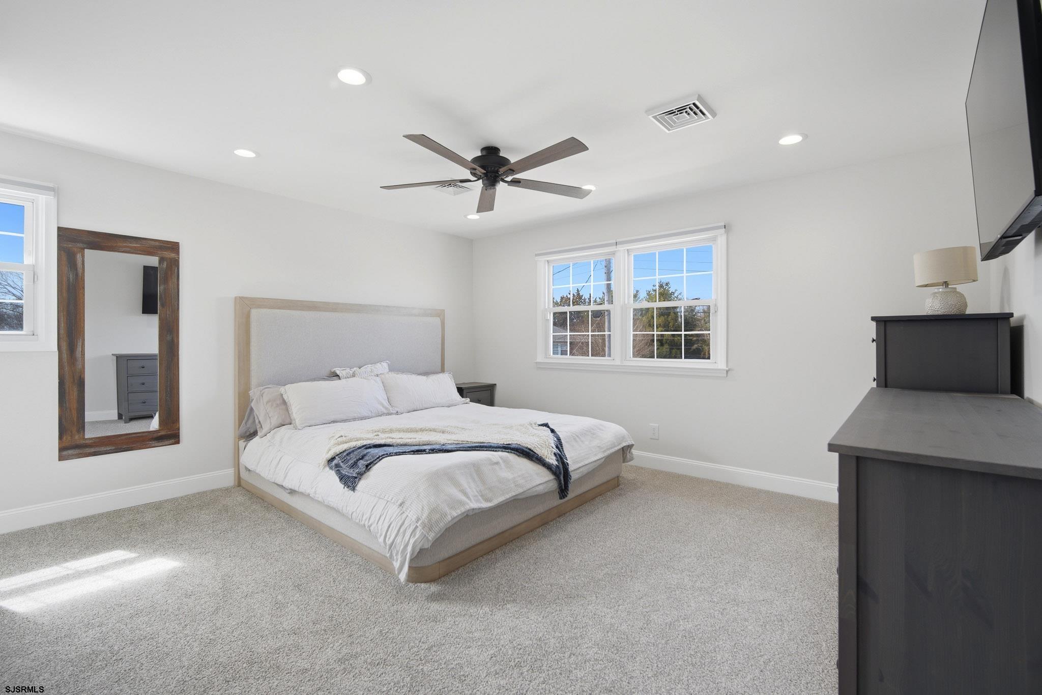 2104 Grove Road Northfield, NJ 08225 - Photo 21 of 33 a bedroom with a large bed and a window