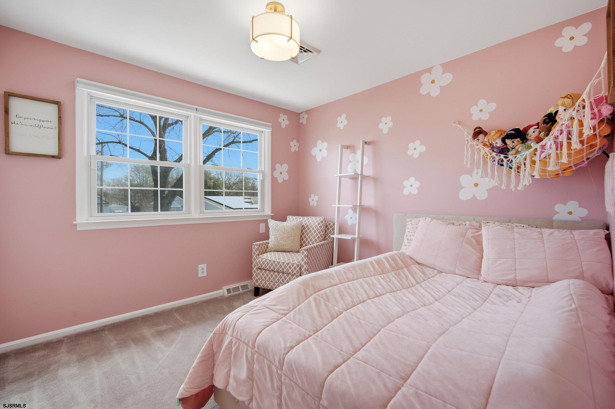 2104 Grove Road Northfield, NJ 08225 - Photo 25 of 33 a bedroom with a large bed and a large window