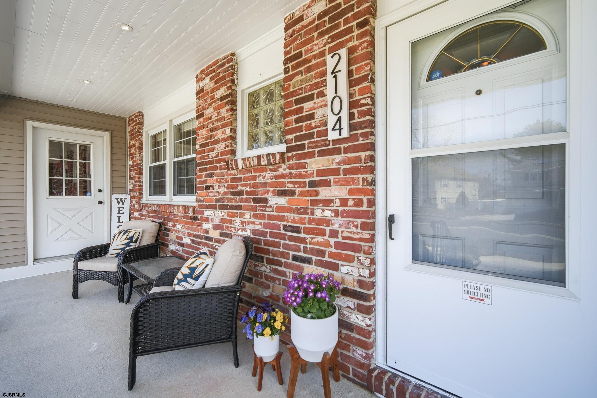 2104 Grove Road Northfield, NJ 08225 - Photo 3 of 33 a outdoor living space with furniture and a potted plant