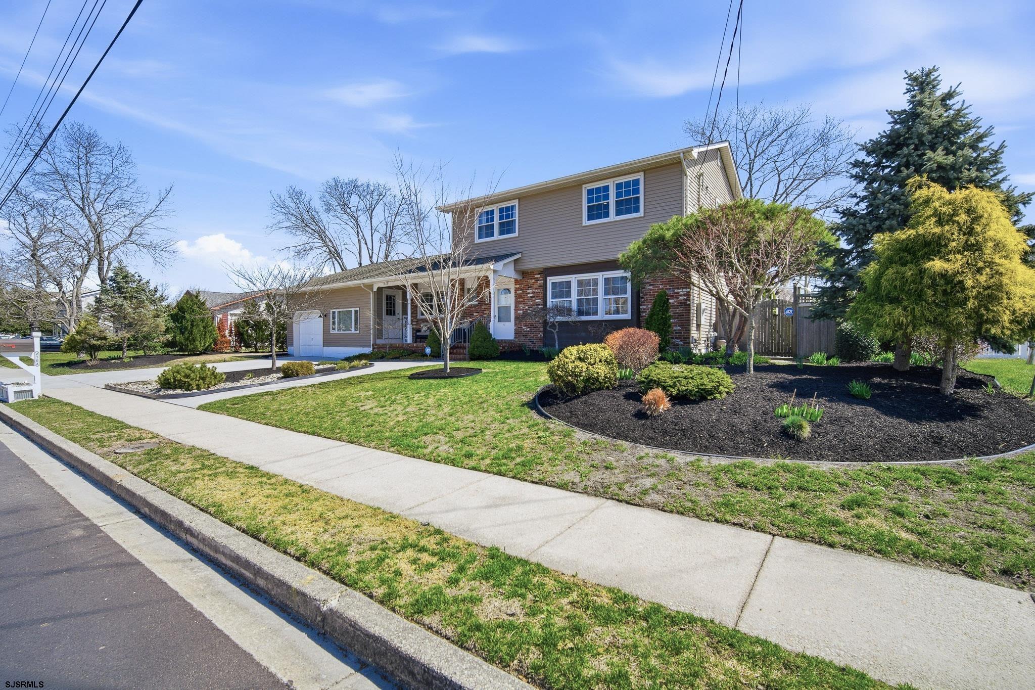 2104 Grove Road Northfield, NJ 08225 - Photo 33 of 33 a front view of a house with garden