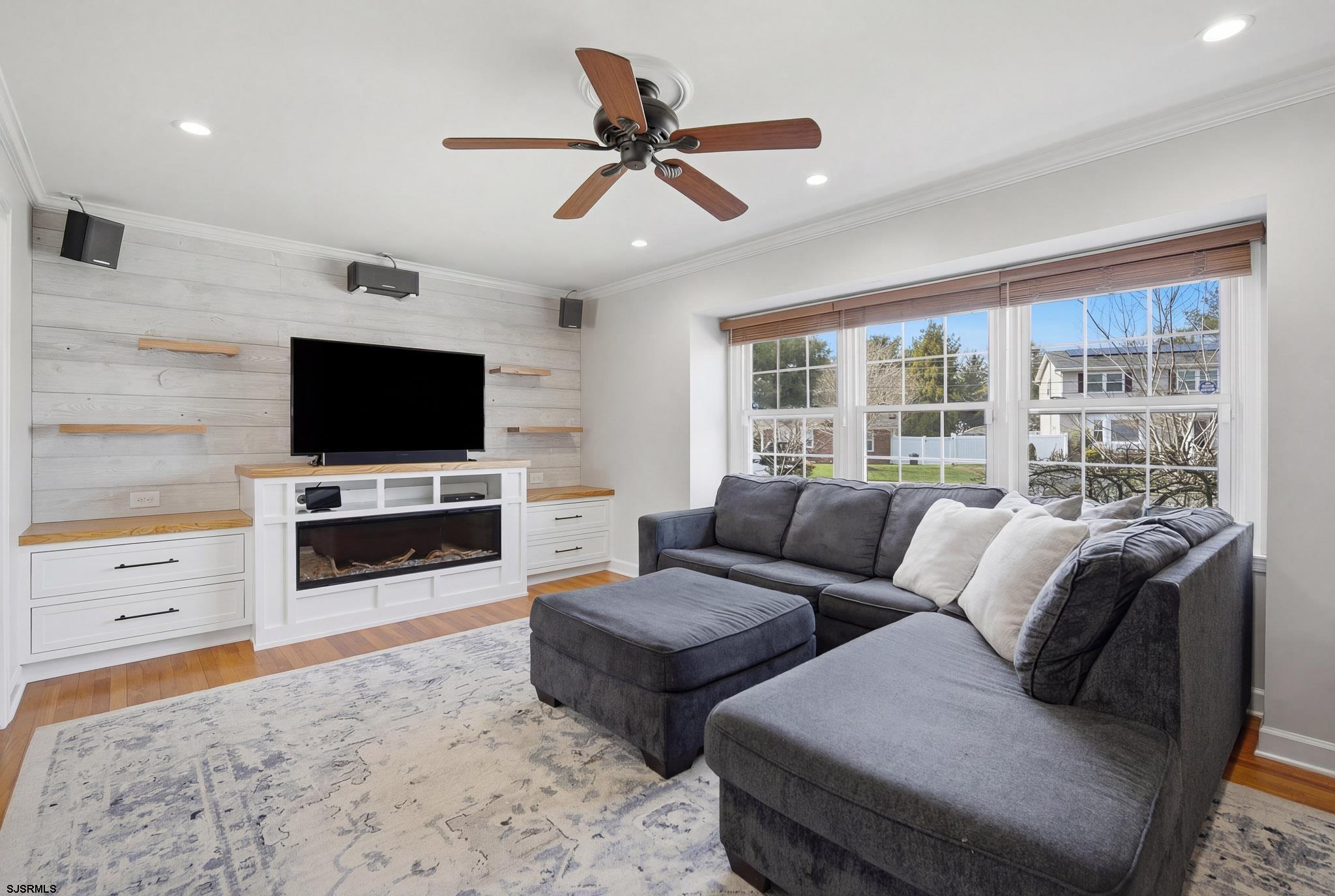 2104 Grove Road Northfield, NJ 08225 - Photo 4 of 33 a living room with furniture and a flat screen tv