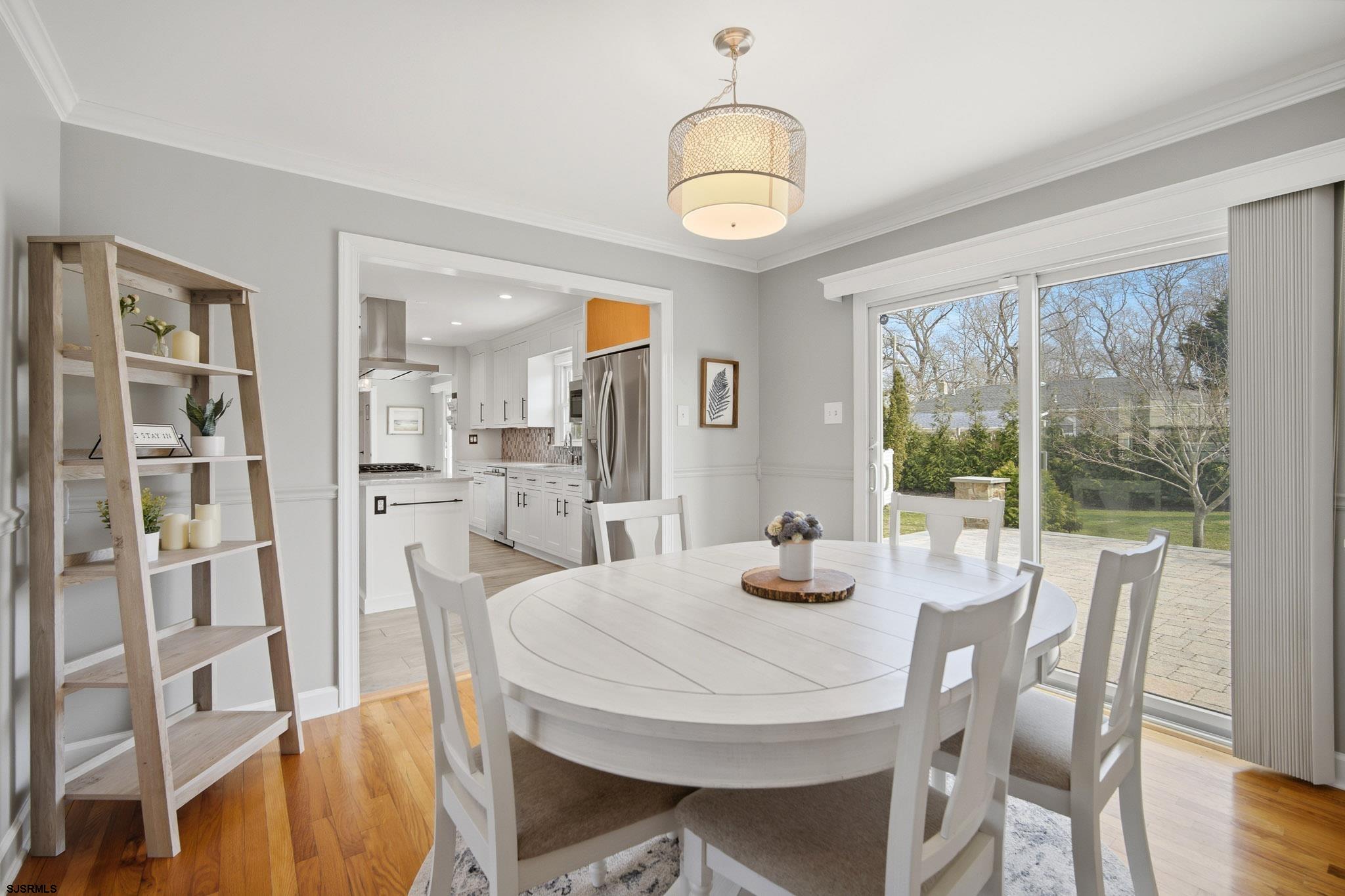 2104 Grove Road Northfield, NJ 08225 - Photo 6 of 33 a view of a dining room with furniture window and wooden floor