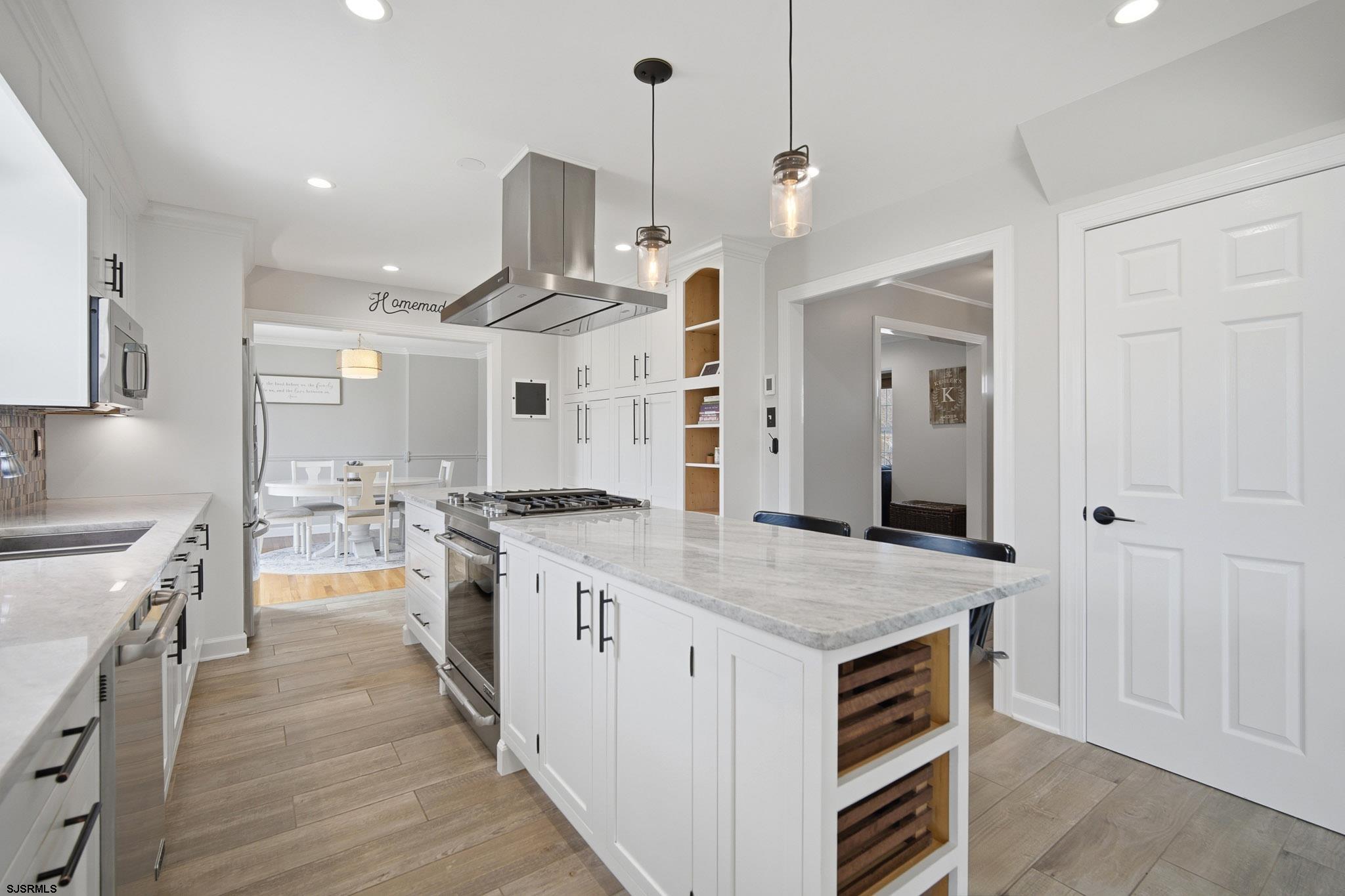 2104 Grove Road Northfield, NJ 08225 - Photo 9 of 33 a kitchen with a stove and a wooden floor