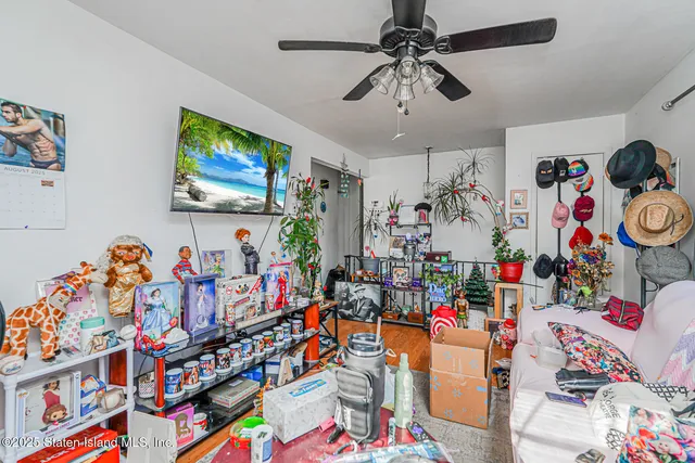 a view of a play room with toys and a flat screen tv