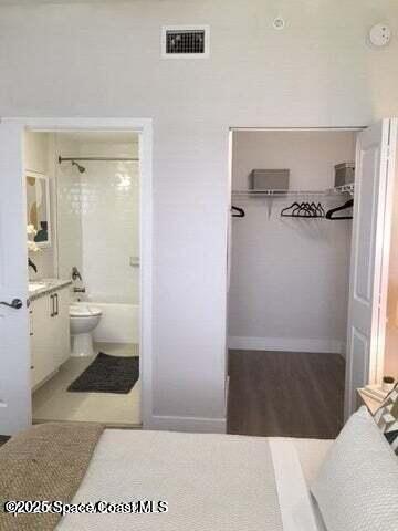 2750 Bosque Circle, Unit 304 Melbourne, FL 32940 - Photo 11 of 18 a bathroom with a sink and a mirror