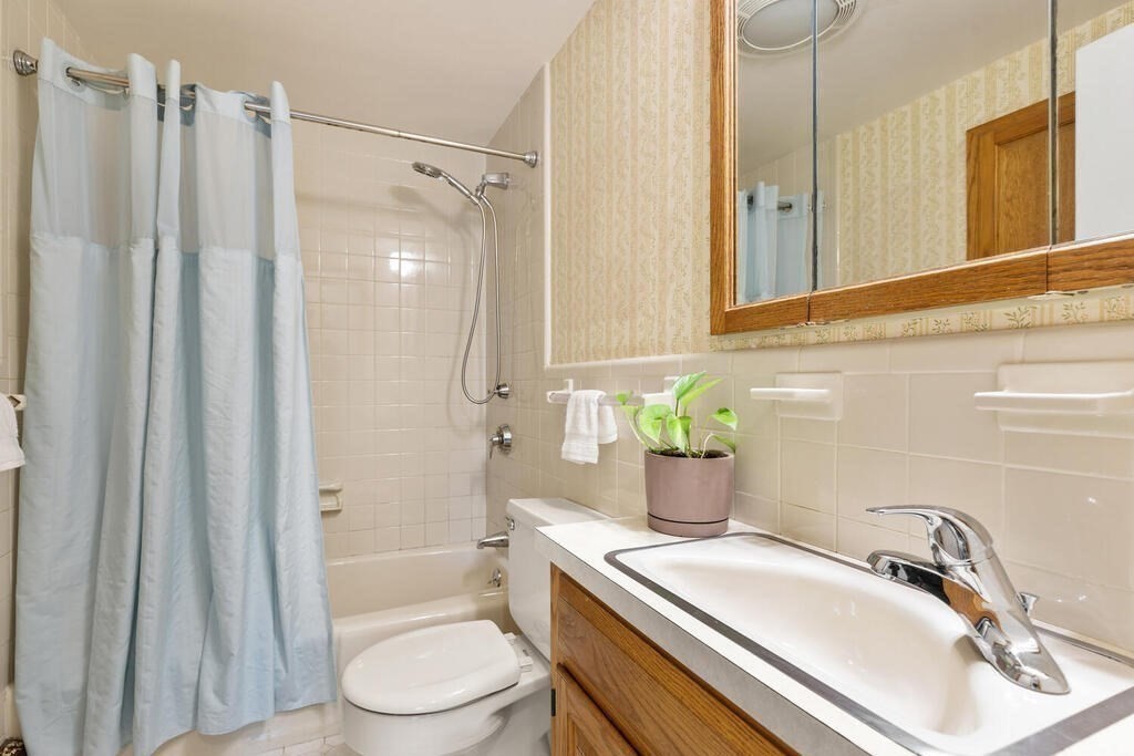 92 Middle Street Lexington, MA 02421 - Photo 13 of 25 a bathroom with a sink toilet and shower
