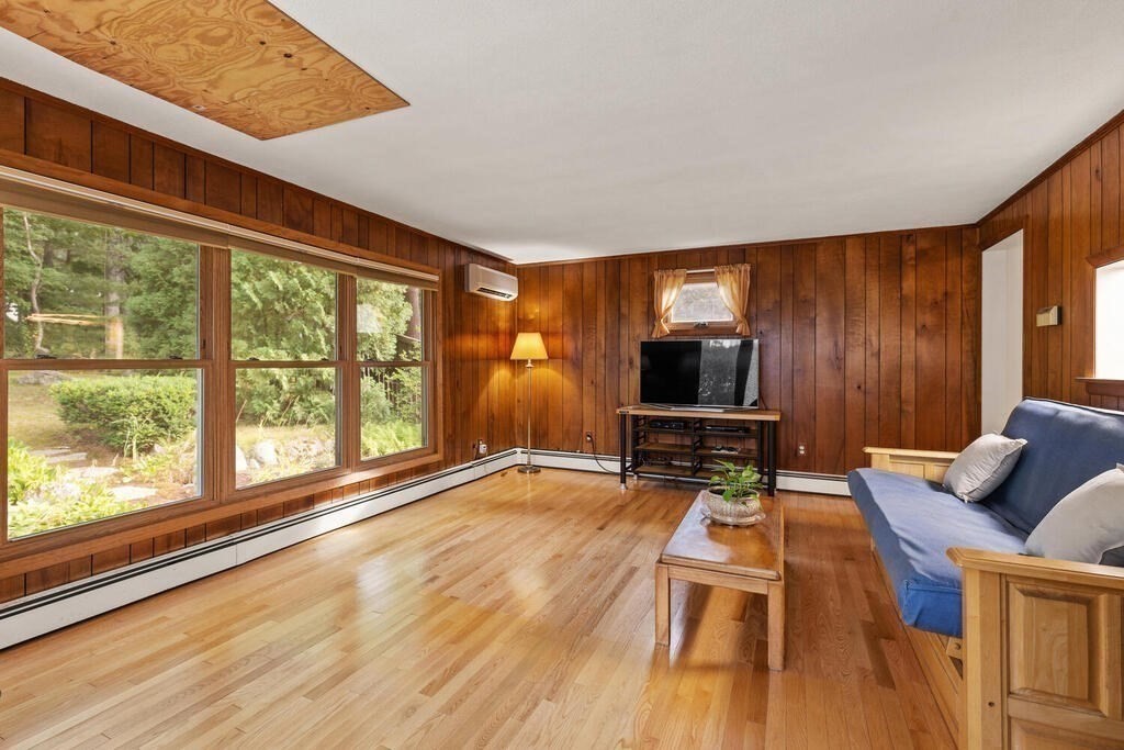 92 Middle Street Lexington, MA 02421 - Photo 6 of 25 a living room with furniture and a flat screen tv