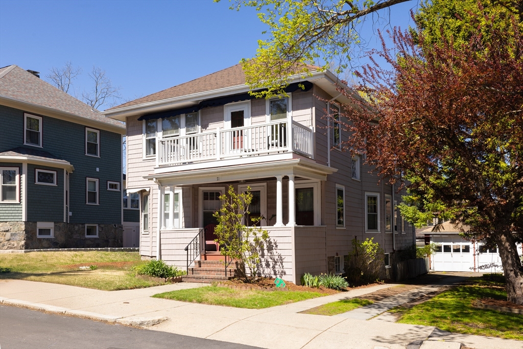 71 Congreve Street, Unit 2 Boston, MA 02131 - Photo 1 of 12 a front view of a house with a yard