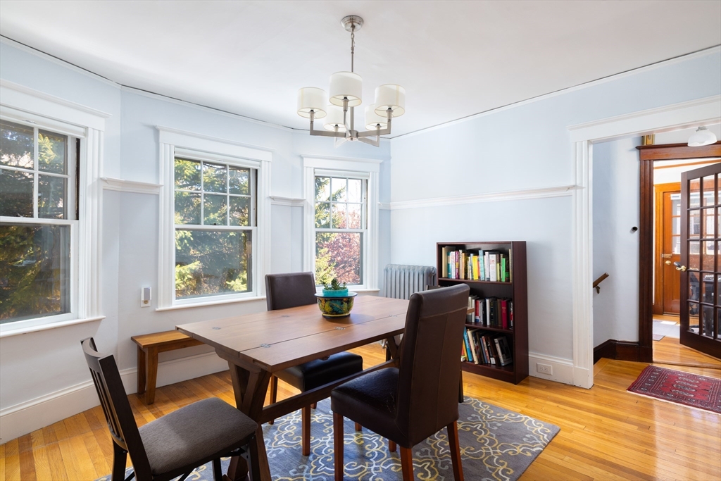 71 Congreve Street, Unit 2 Boston, MA 02131 - Photo 3 of 12 a view of a dining room with furniture window and wooden floor